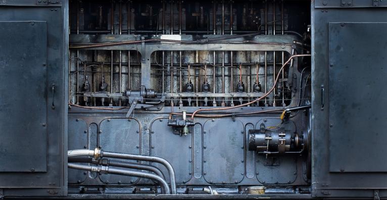 old part of a machine, dark looks like a part of a locomotive